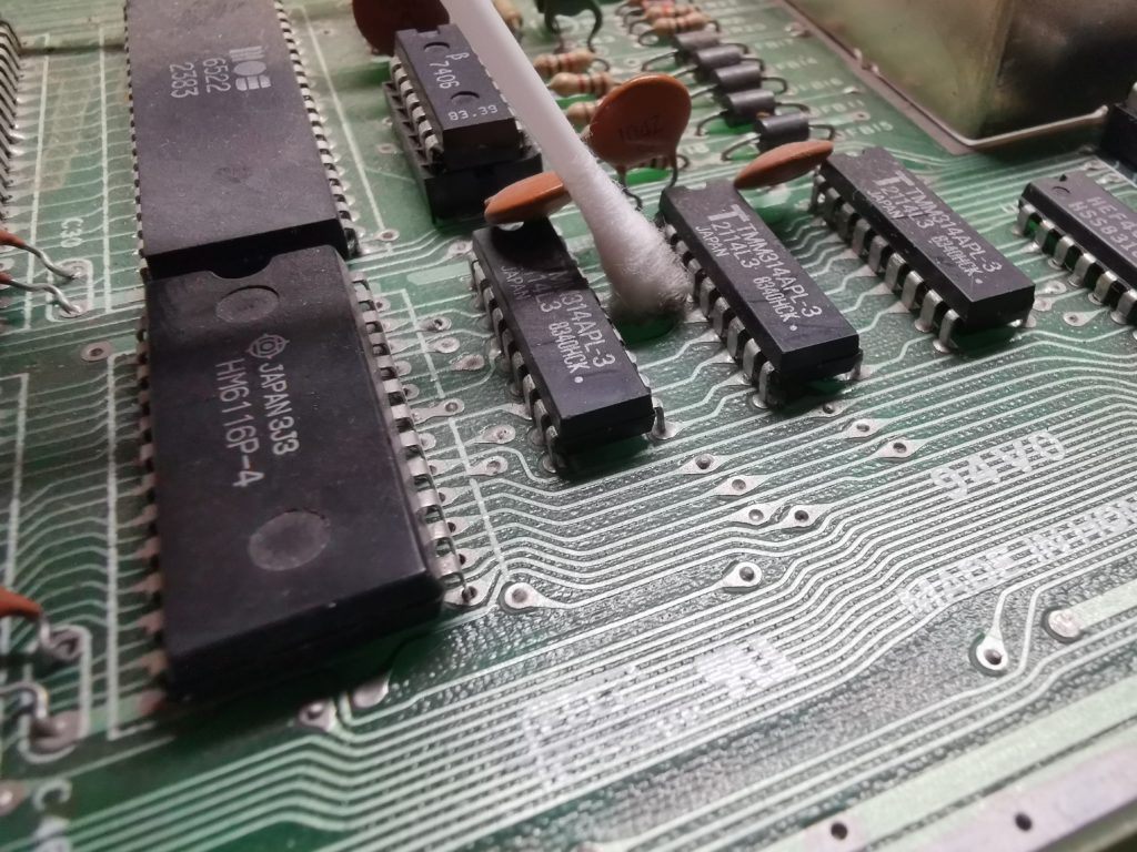 Cleaning motherboard with cotton bud