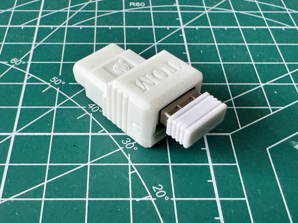 Tom adapter with USB receiver plugged in